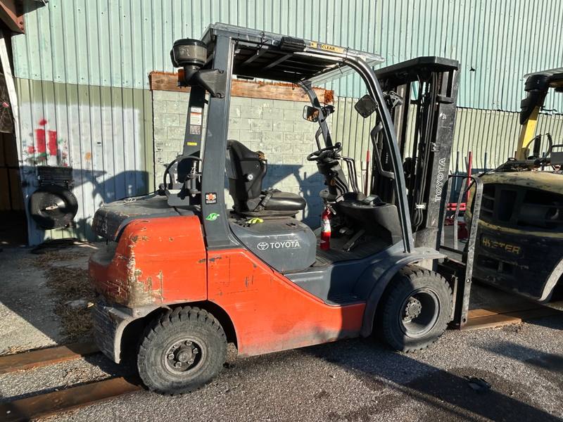 Orange Toyota warehouse forklift we bought in Central Florida