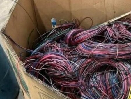 Box filled with bundled insulated copper wire available as a material example