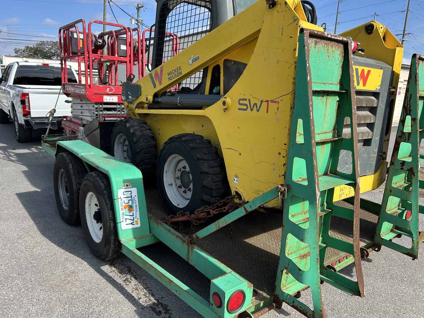 Wacker Neuson skid steer loader on a trailer, purchased from a Florida seller