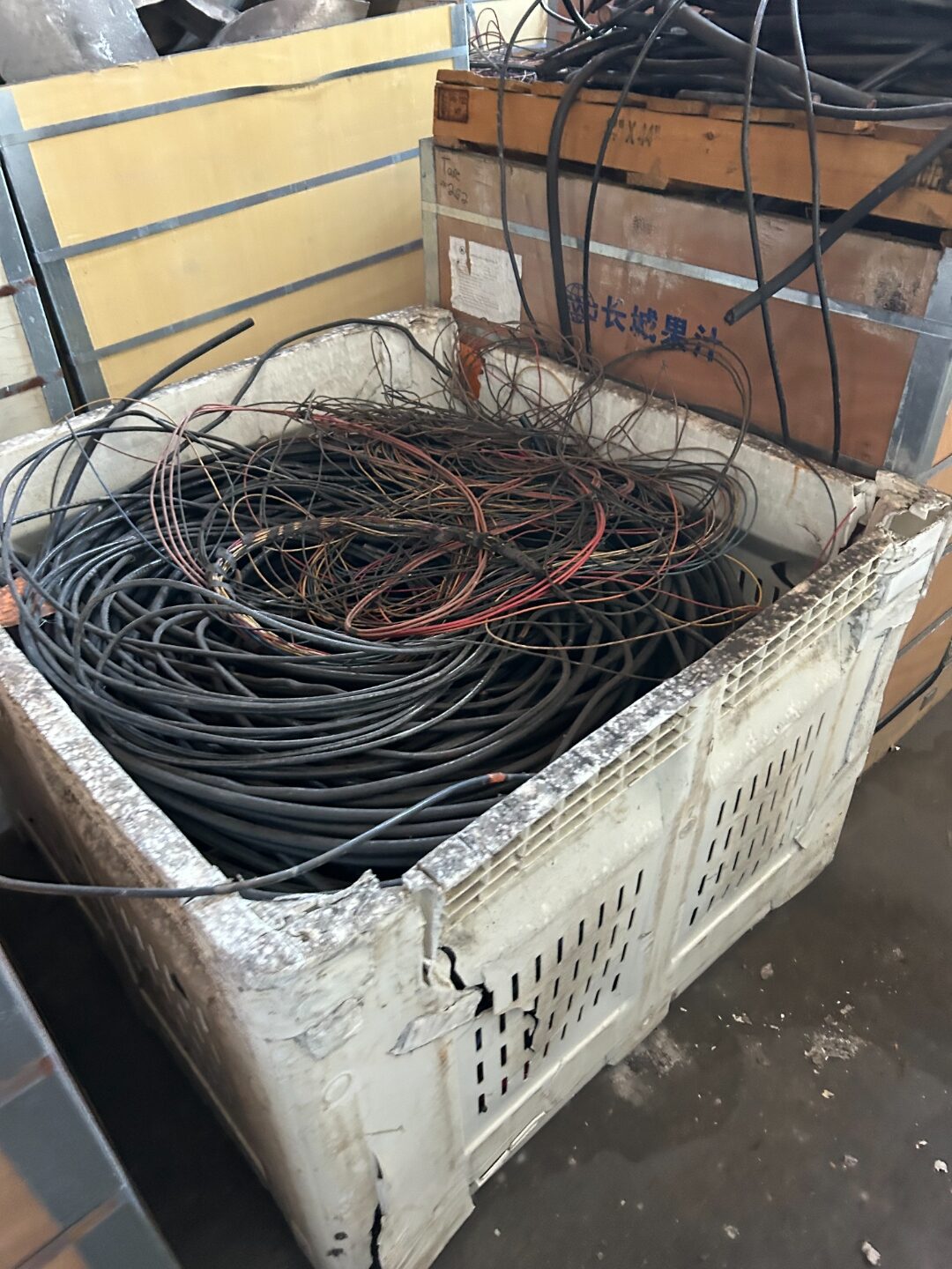 Crate of black insulated cable in a warehouse